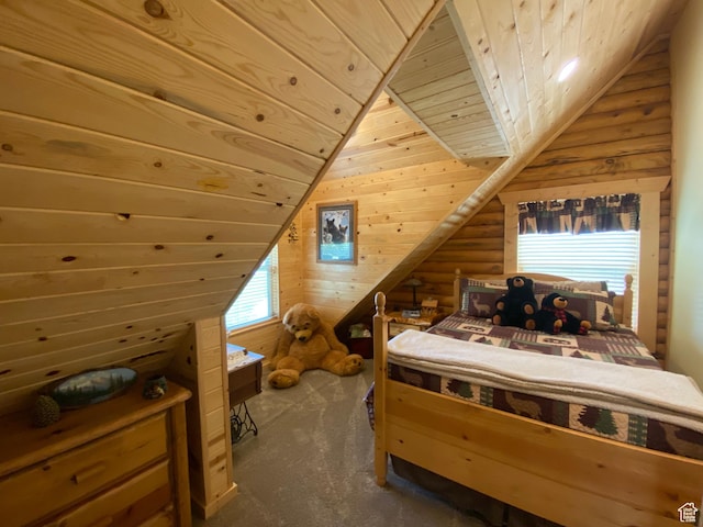 bedroom with wood walls, wooden ceiling, vaulted ceiling, and rustic walls