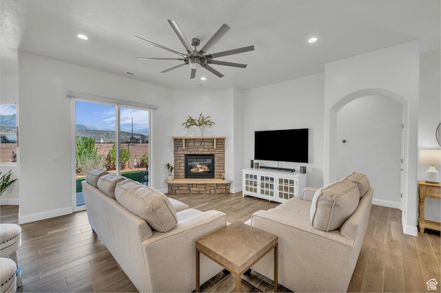 3086 W 570 N, Hurricane, UT 84737 - living area featuring arched walkways, wood finished floors, and a ceiling fan