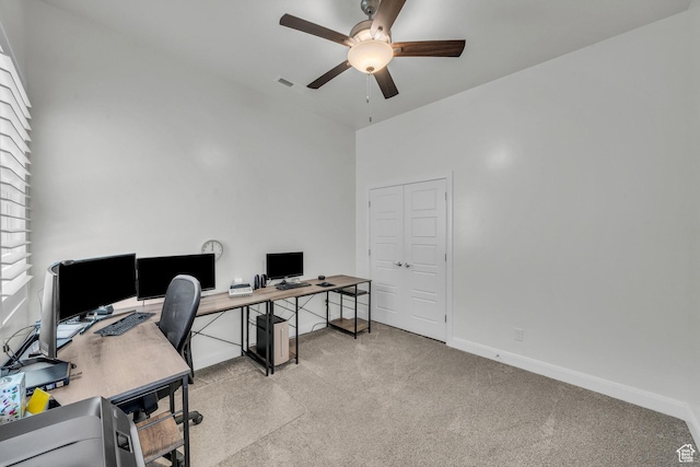 3086 W 570 N, Hurricane, UT 84737 - home office with visible vents, baseboards, ceiling fan, a towering ceiling, and light colored carpet