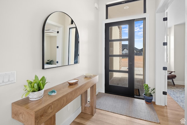 foyer featuring wood finished floors