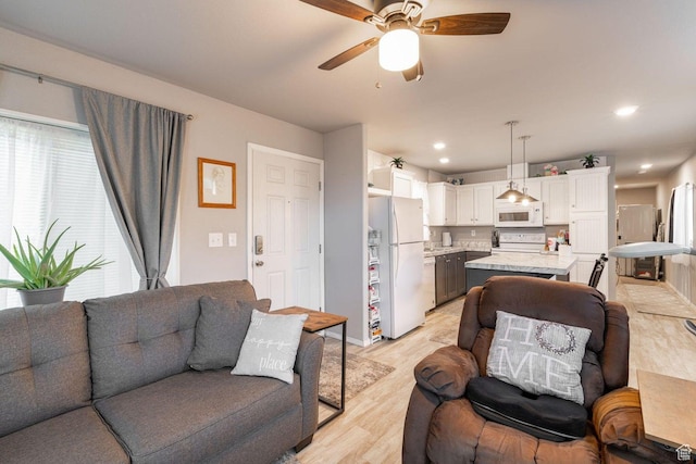 1150 W Red Hills Pkwy Unit 57, Washington, UT 84780 - living area featuring recessed lighting, light wood-style floors, and a ceiling fan
