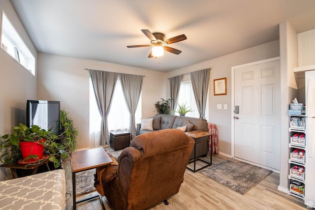 1150 W Red Hills Pkwy Unit 57, Washington, UT 84780 - living area with light wood-style flooring, ceiling fan, baseboards, and plenty of natural light