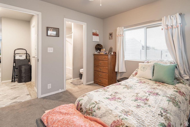 1150 W Red Hills Pkwy Unit 57, Washington, UT 84780 - carpeted bedroom with ensuite bathroom and baseboards