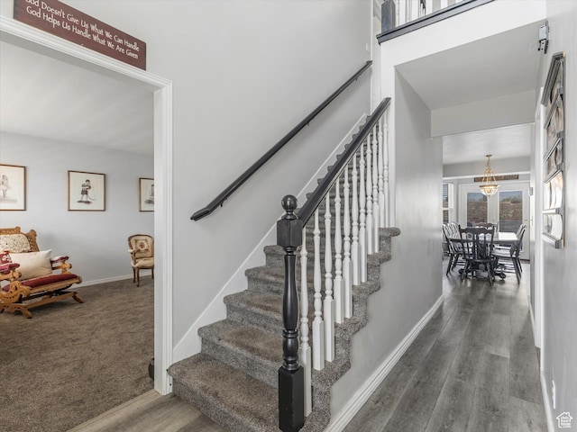 4572 W Bingham Park Dr S, West Jordan, UT 84088 - staircase with wood finished floors, baseboards, and a towering ceiling