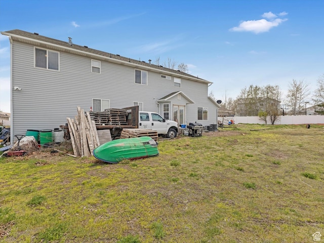 4572 W Bingham Park Dr S, West Jordan, UT 84088 - back of property featuring fence and a lawn