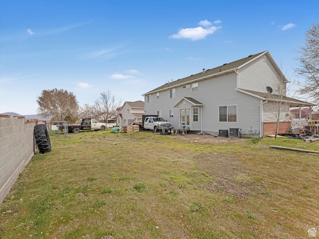4572 W Bingham Park Dr S, West Jordan, UT 84088 - rear view of house with a yard and fence