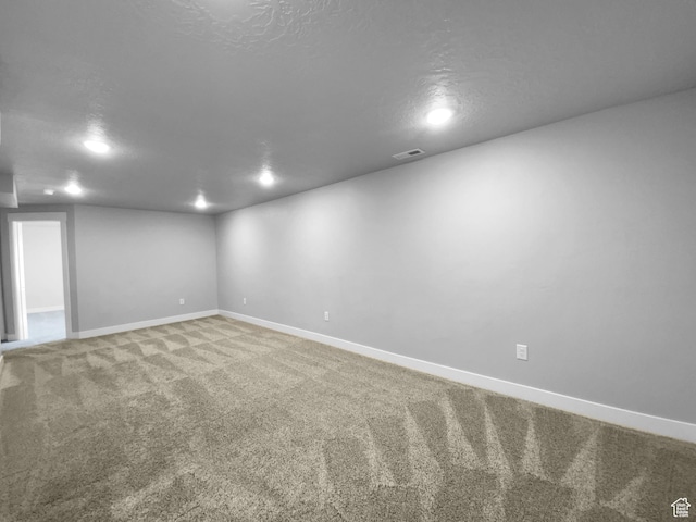 2806 E Crimson Ct, Eagle Mountain, UT 84005 - finished basement featuring a textured ceiling, visible vents, recessed lighting, carpet floors, and baseboards