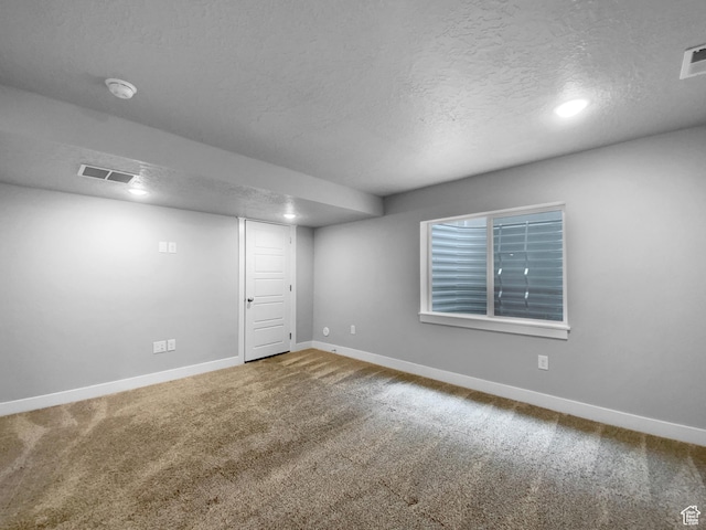 2806 E Crimson Ct, Eagle Mountain, UT 84005 - finished basement featuring visible vents, baseboards, carpet, and a textured ceiling