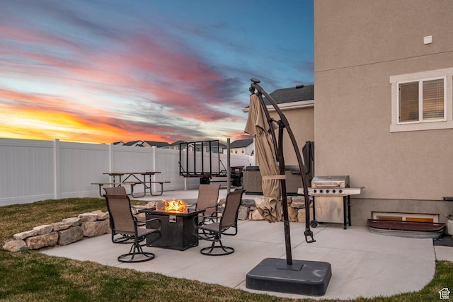 7091 N Oquirrh Ranch Pkwy, Eagle Mountain, UT 84005 - view of patio with area for grilling, fence, and a fire pit