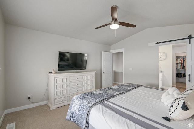 7091 N Oquirrh Ranch Pkwy, Eagle Mountain, UT 84005 - bedroom featuring visible vents, baseboards, a barn door, vaulted ceiling, and light carpet