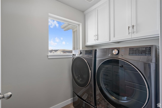 7091 N Oquirrh Ranch Pkwy, Eagle Mountain, UT 84005 - laundry area featuring cabinet space, baseboards, and washing machine and dryer