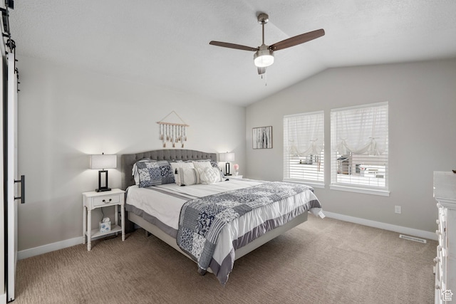 7091 N Oquirrh Ranch Pkwy, Eagle Mountain, UT 84005 - bedroom with a barn door, carpet, visible vents, and lofted ceiling