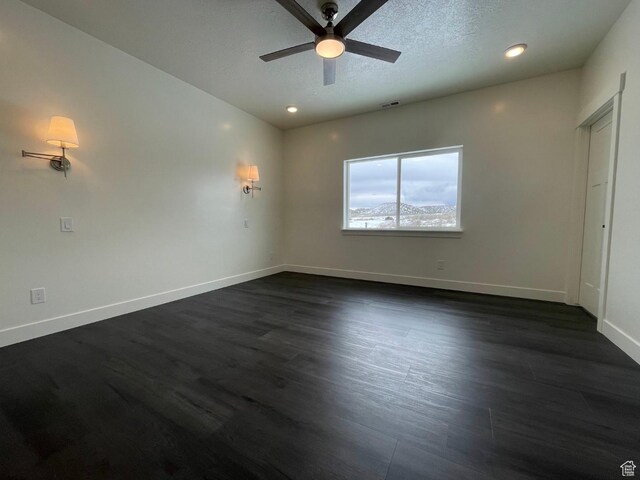 631 N 4250 W, Vernal, UT 84078 - unfurnished room featuring visible vents, baseboards, a ceiling fan, and dark wood-style floors