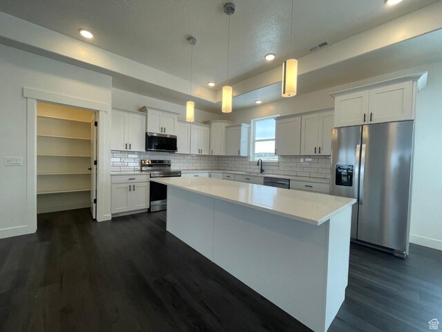631 N 4250 W, Vernal, UT 84078 - kitchen featuring dark wood-style flooring, light countertops, visible vents, and stainless steel appliances
