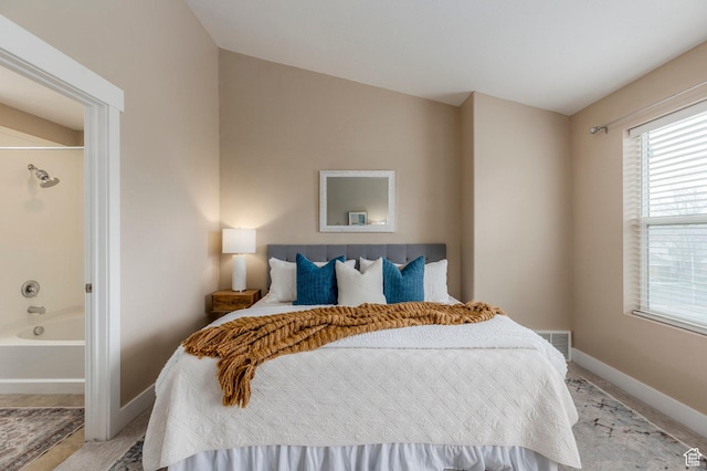 3723 S Gowan Ln W, Salt Lake City, UT 84115 - bedroom with visible vents, baseboards, light colored carpet, and ensuite bathroom