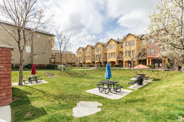 3723 S Gowan Ln W, Salt Lake City, UT 84115 - view of home's community with a patio and a lawn