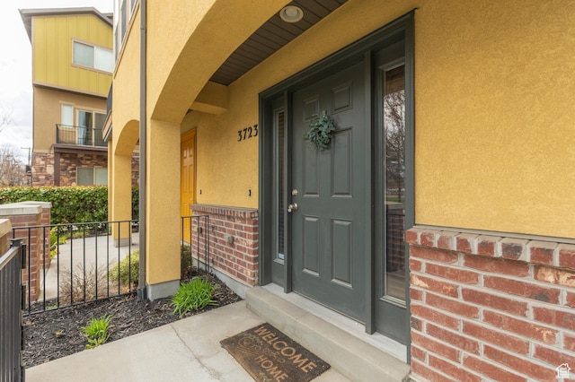 3723 S Gowan Ln W, Salt Lake City, UT 84115 - view of exterior entry featuring stucco siding