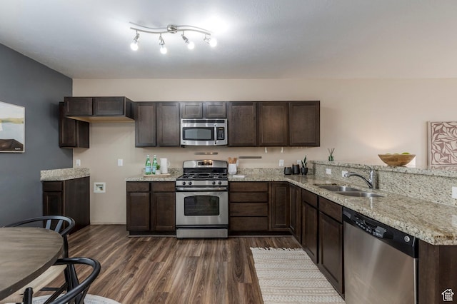 3723 S Gowan Ln W, Salt Lake City, UT 84115 - kitchen featuring appliances with stainless steel finishes, dark wood-style flooring, a sink, and dark brown cabinetry
