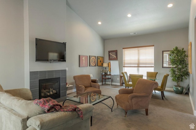 3723 S Gowan Ln W, Salt Lake City, UT 84115 - carpeted living area featuring visible vents, baseboards, a tiled fireplace, recessed lighting, and high vaulted ceiling