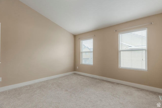 3723 S Gowan Ln W, Salt Lake City, UT 84115 - unfurnished room with carpet flooring, baseboards, and lofted ceiling