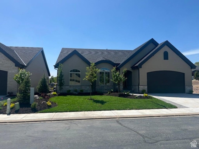15724 S Rolling Bluff Dr, Draper Ut Cnty, UT 84020 - french country inspired facade featuring a garage, driveway, a front lawn, and stucco siding