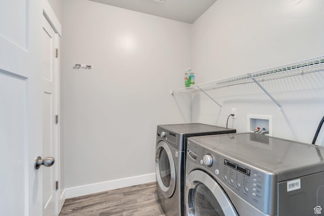108 W Seasons Dr, Vineyard, UT 84059 - clothes washing area with separate washer and dryer, laundry area, baseboards, and wood finished floors