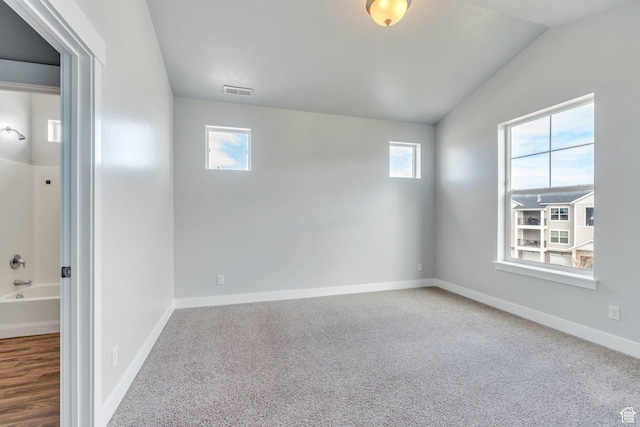 108 W Seasons Dr, Vineyard, UT 84059 - carpeted spare room featuring visible vents, baseboards, and vaulted ceiling