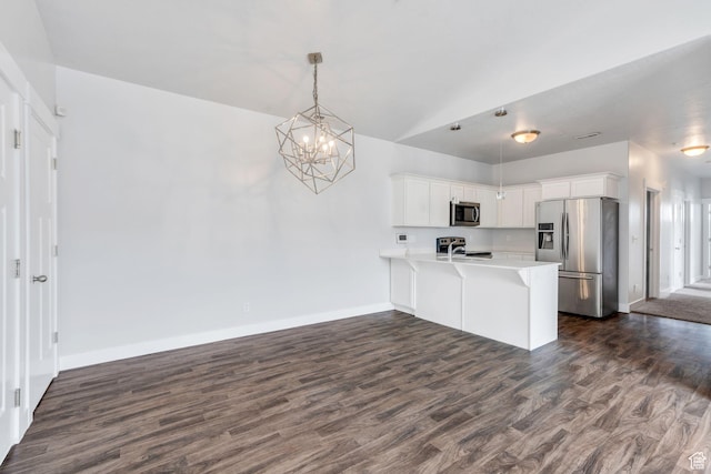 108 W Seasons Dr, Vineyard, UT 84059 - kitchen with open floor plan, a chandelier, a peninsula, dark wood finished floors, and stainless steel appliances