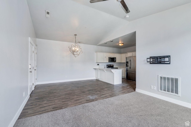 108 W Seasons Dr, Vineyard, UT 84059 - unfurnished living room with ceiling fan with notable chandelier, high vaulted ceiling, baseboards, and visible vents