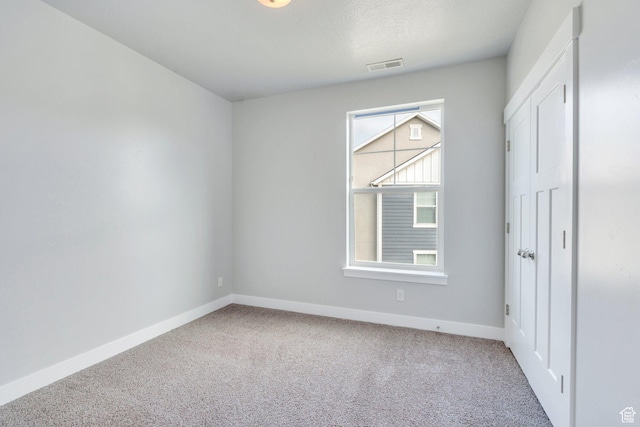 108 W Seasons Dr, Vineyard, UT 84059 - empty room featuring carpet flooring, visible vents, and baseboards