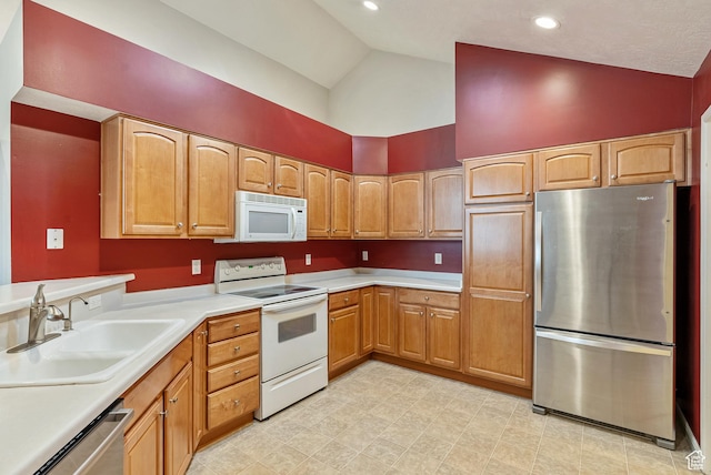 kitchen featuring high vaulted ceiling, light countertops, a sink, and appliances with stainless steel finishes
