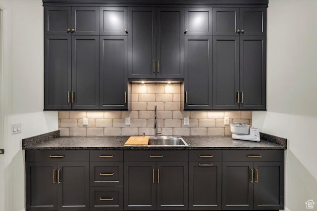 kitchen with decorative backsplash and a sink
