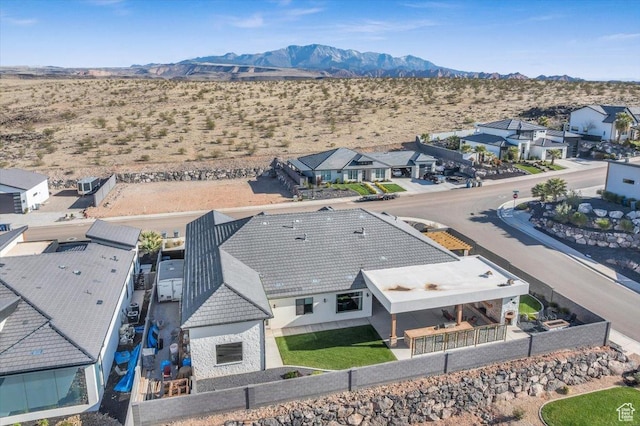 drone / aerial view featuring a mountain view and view of desert