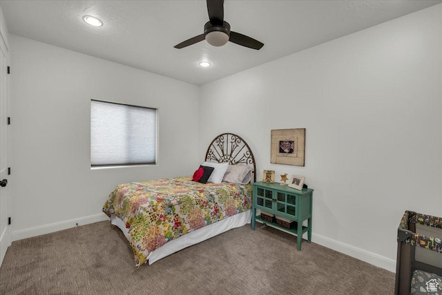 carpeted bedroom featuring baseboards, recessed lighting, and a ceiling fan