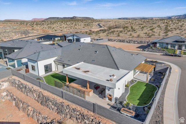 birds eye view of property featuring a residential view, a mountain view, and a desert view