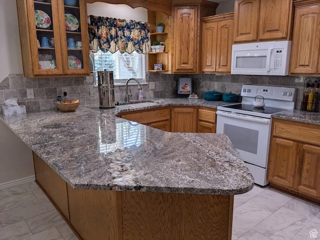 641 W 3550 S, Riverdale, UT 84405 - kitchen with marble finish floor, a peninsula, white appliances, a sink, and dark stone countertops