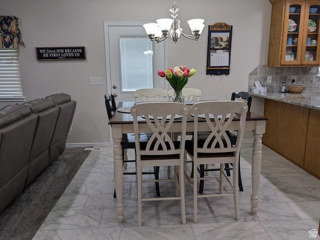 641 W 3550 S, Riverdale, UT 84405 - dining room with baseboards, an inviting chandelier, and marble finish floor