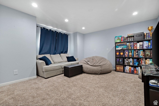 living area with recessed lighting and carpet
