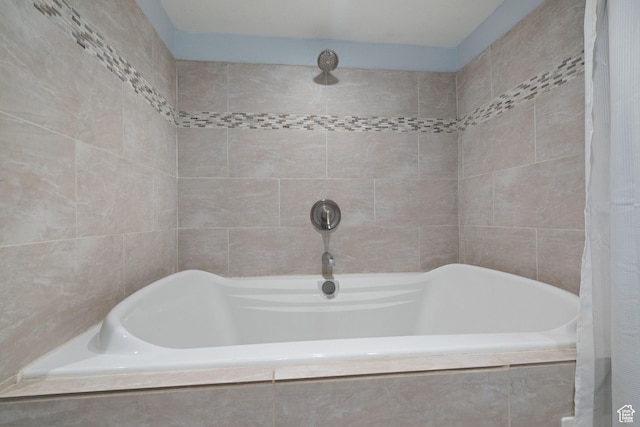 bathroom featuring tiled shower, tile walls, and tiled bath