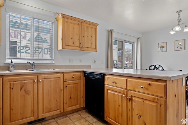 kitchen featuring a peninsula, visible vents, black dishwasher, light countertops, and a sink
