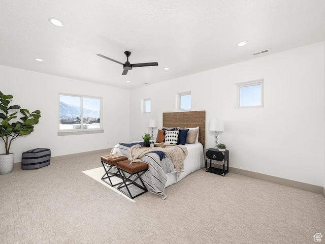 bedroom featuring a ceiling fan, visible vents, recessed lighting, carpet flooring, and baseboards