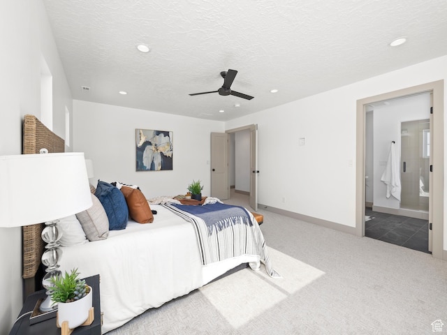 carpeted bedroom with baseboards, recessed lighting, ensuite bathroom, a textured ceiling, and a ceiling fan