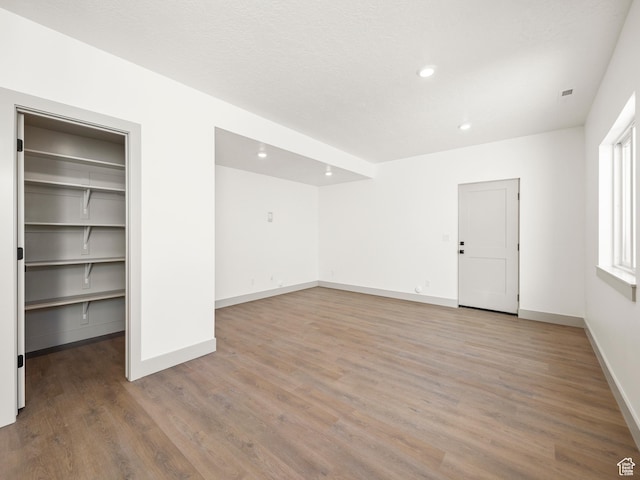 interior space with visible vents, baseboards, recessed lighting, and light wood-style floors