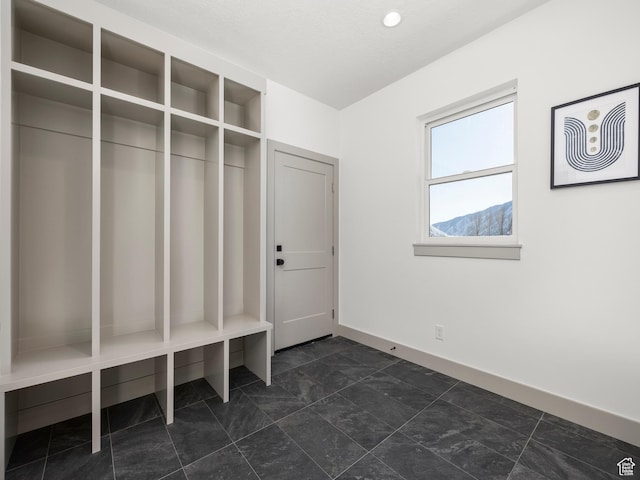 mudroom featuring baseboards