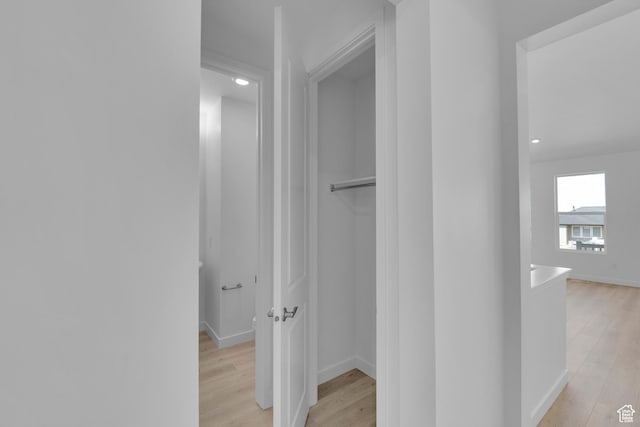 356 W Emma St Unit 625, Grantsville, UT 84029 - hallway with light wood finished floors, an upstairs landing, and baseboards