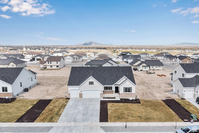 drone / aerial view with a mountain view and a residential view