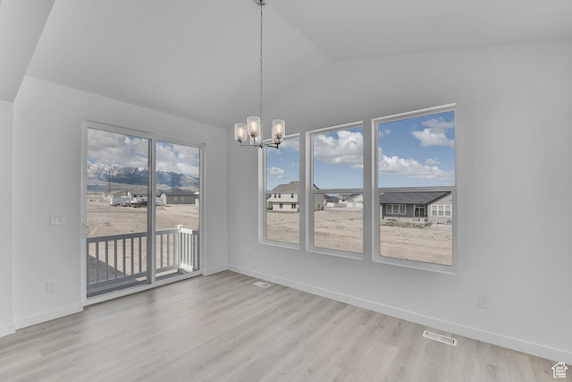 356 W Emma St Unit 625, Grantsville, UT 84029 - unfurnished dining area with visible vents, baseboards, a chandelier, vaulted ceiling, and wood finished floors