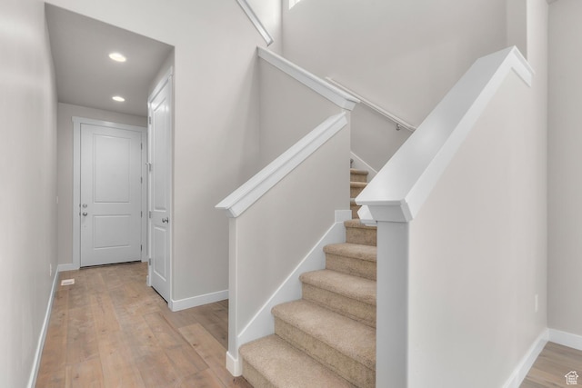 6633 N Price, Eagle Mountain, UT 84005 - stairway with hardwood / wood-style floors, baseboards, and recessed lighting