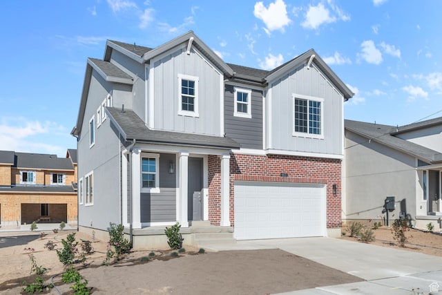 6633 N Price, Eagle Mountain, UT 84005 - view of front of home with an attached garage, board and batten siding, concrete driveway, and brick siding