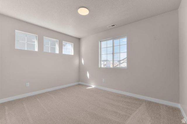 6624 W Prairie Fire Ln, Herriman, UT 84096 - carpeted empty room featuring visible vents, baseboards, and a textured ceiling